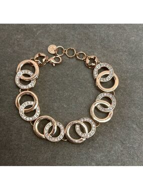Absolute rose gold tone circular interlocking chain-link rhinestone bracelet